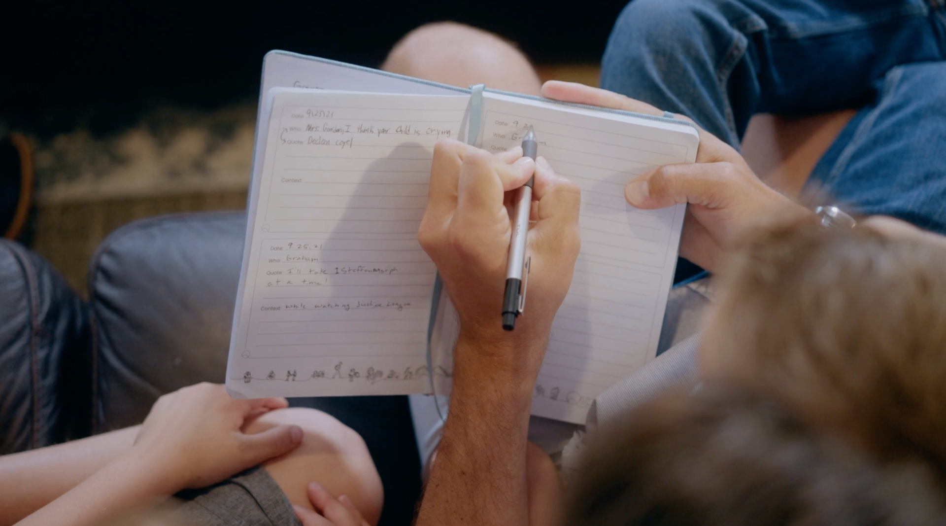 Family writing in Quotebook together