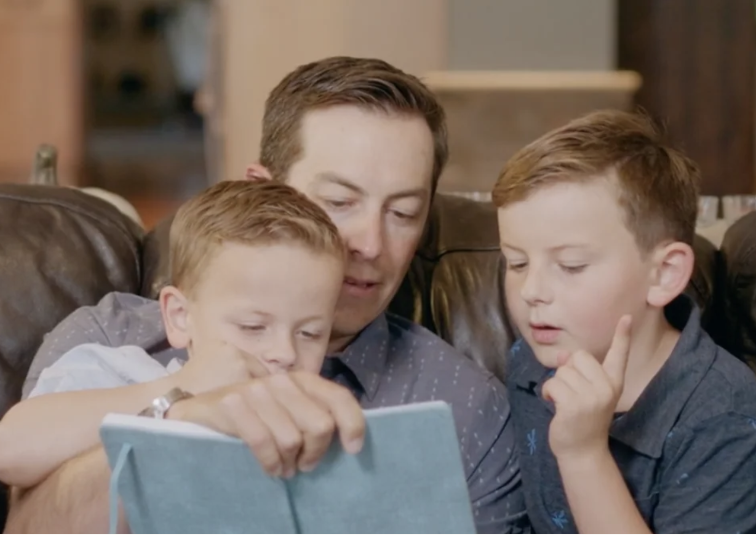 Family reading Quotebook together